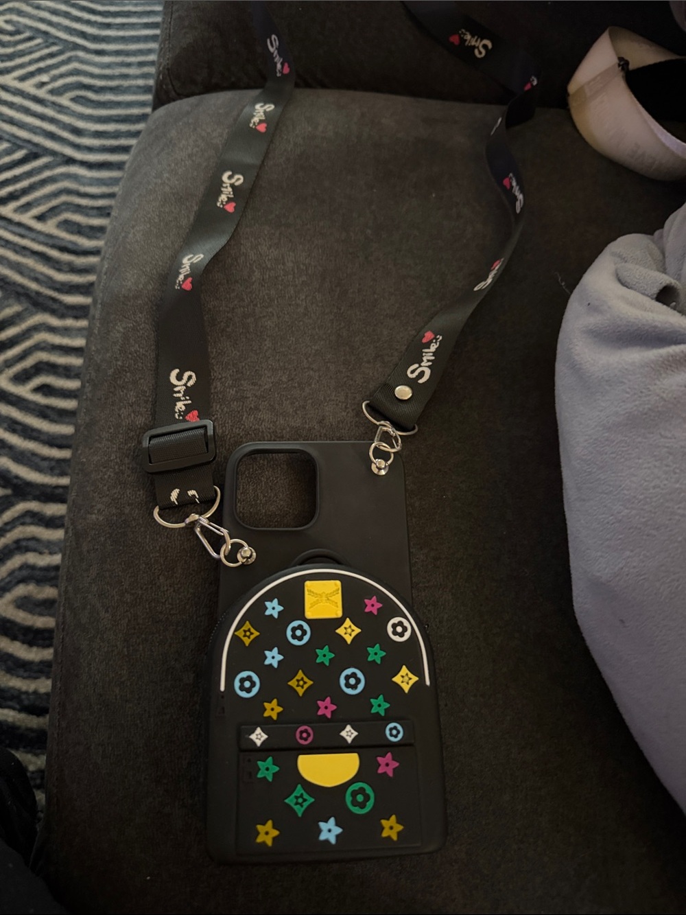 Black Silicone Crossbody Phone Case with Multicolor Logo Accents
